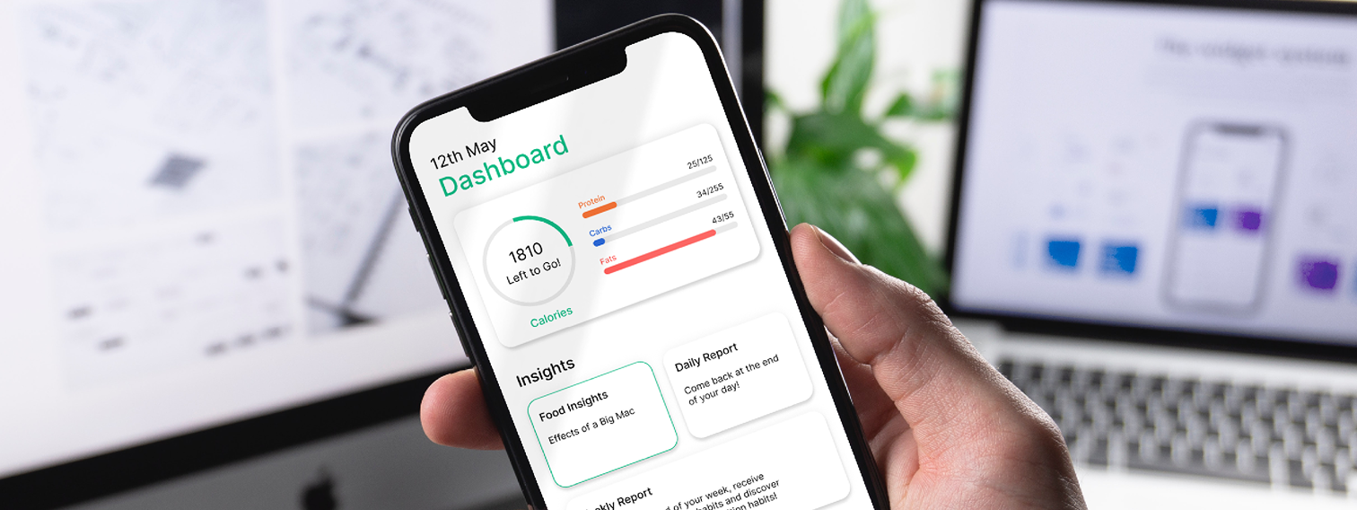 Hand holding a smartphone displaying the Nurture nutrition app dashboard
