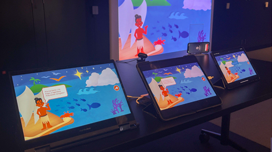 Tablets and projector displaying the interactive exhibition setup